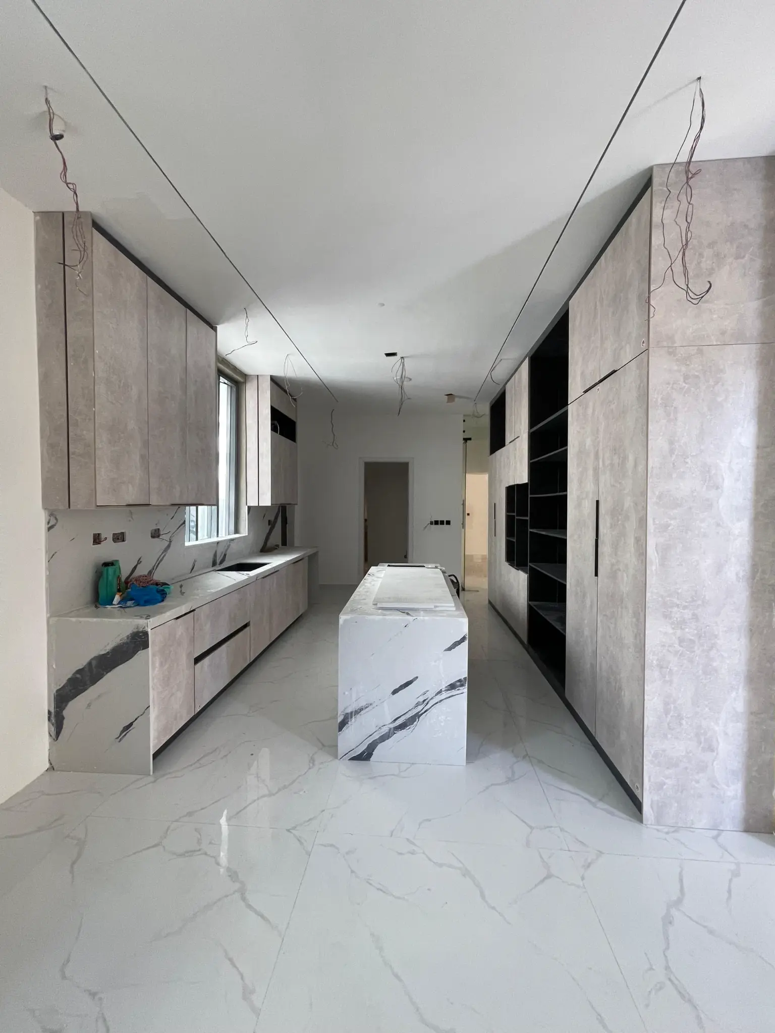 Fitted kitchen with island in the Osapa London duplex