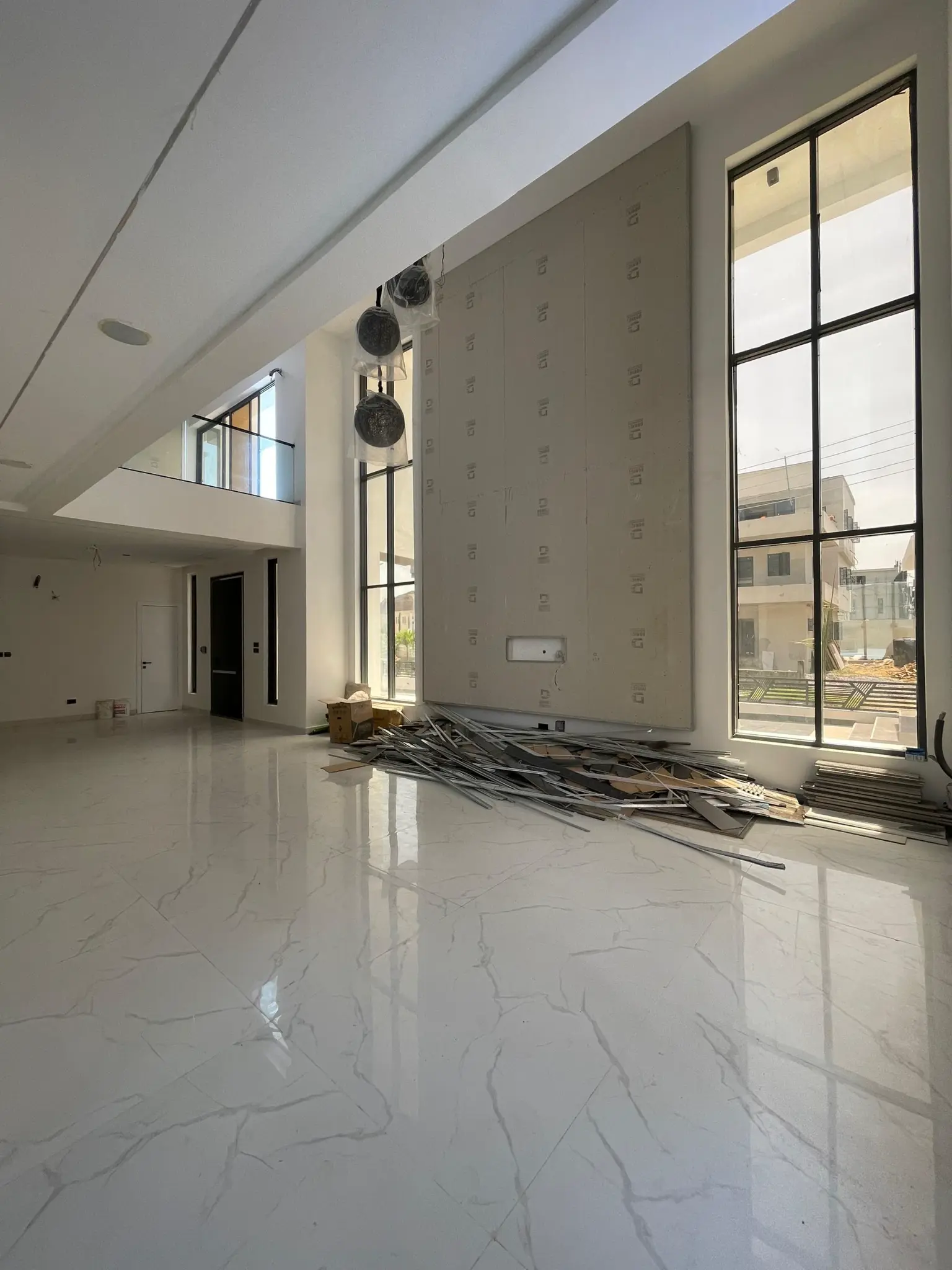 Double-volume living room detail inside the Osapa London duplex
