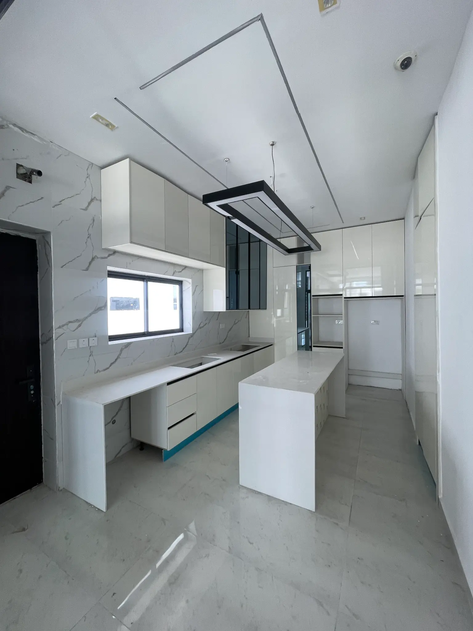 Fitted kitchen with island inside the Orchid Lekki duplex