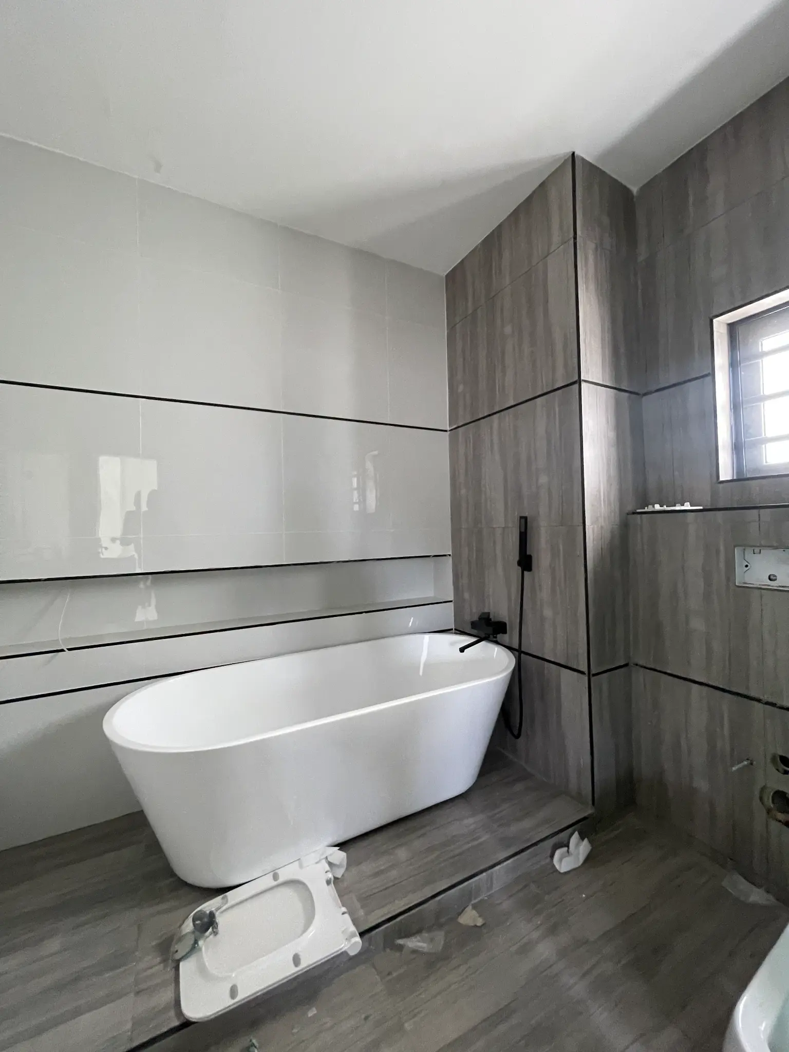 Freestanding bathtub and bathroom detail inside the Ajah duplex